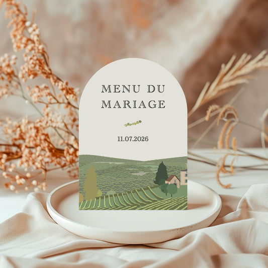 Menu de mariage en arche illustré avec un paysage de champs et vignes des Pyrénées